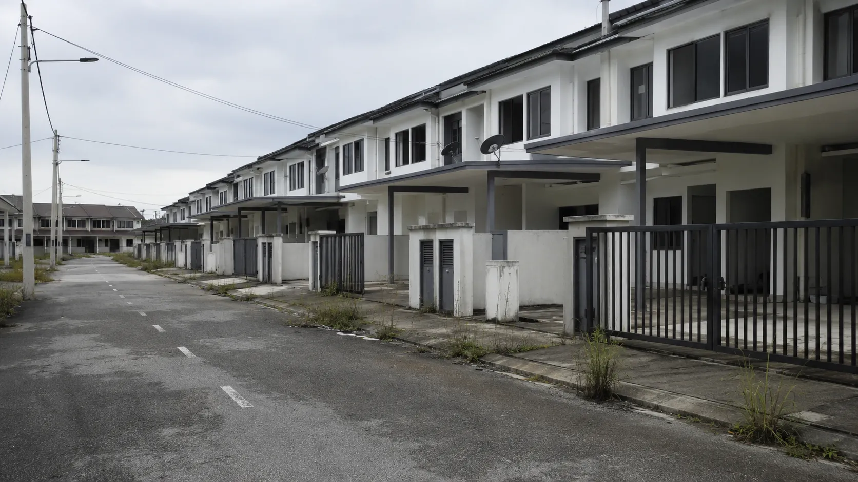 Rows of newly built but empty terrace houses in a quiet Malaysian development