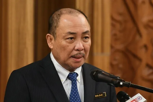 Chief Minister of Sabah, Datuk Seri Hajiji Noor gives response to journalist in front of a podium