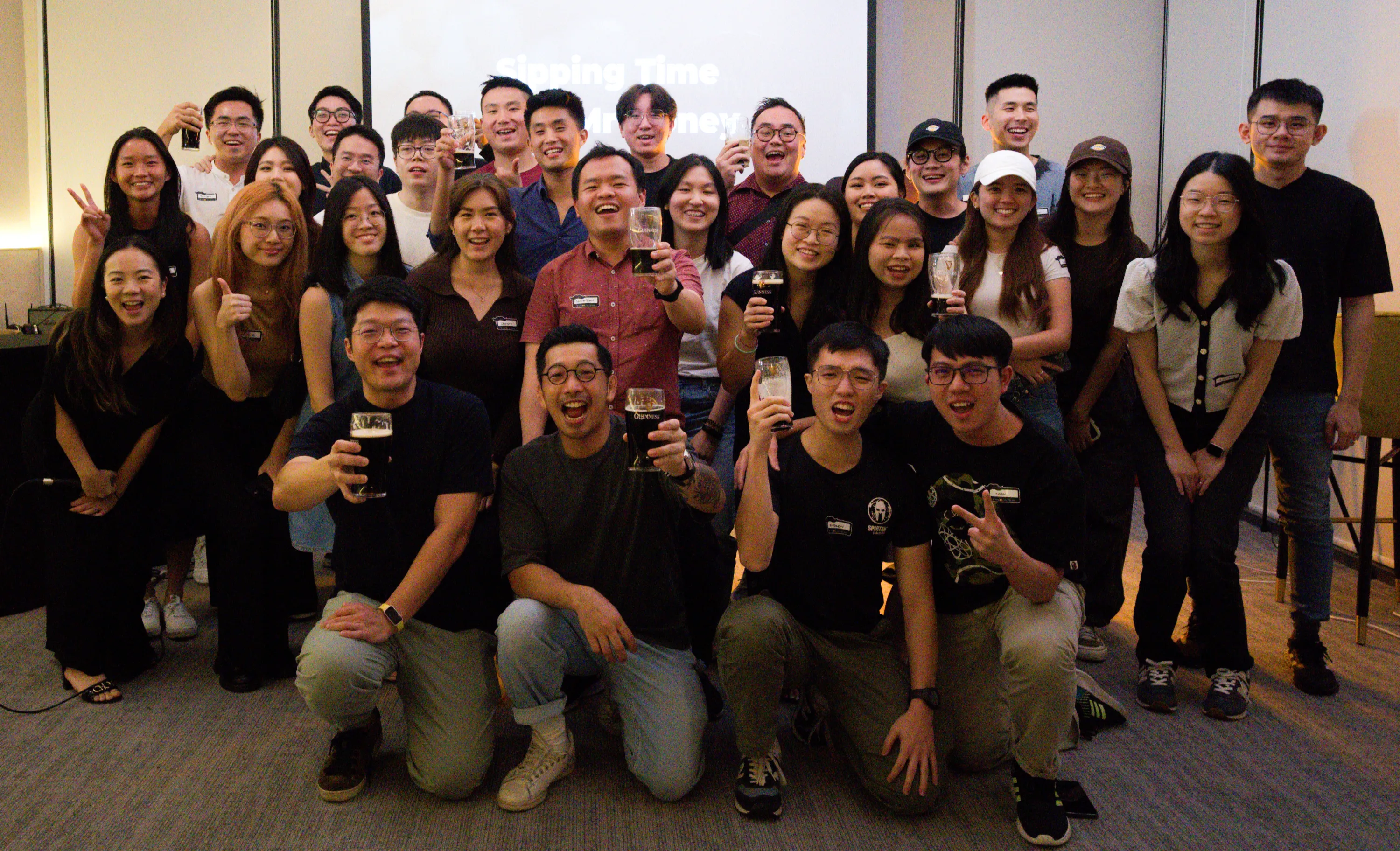 A group photo of the participants and hosts celebrating a good event